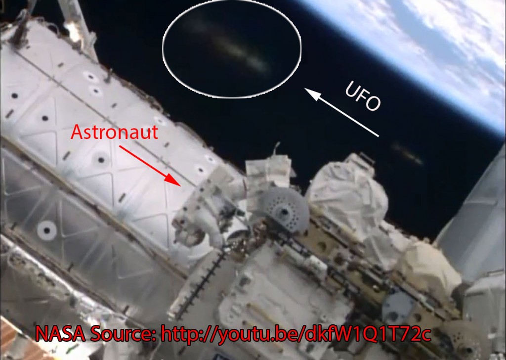 UFO near spacewalking astronauts